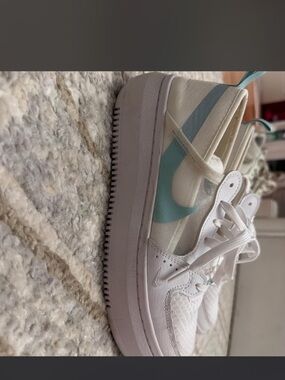 Nike womens White Sneakers with Light Teal Swoosh